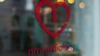 image of NM Cardiology signage on glass