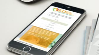 image of QED Accreditation Advisors website on mobile device