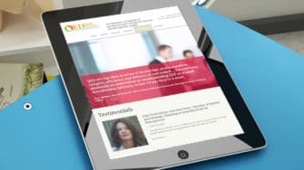 image of QED Accreditation Advisors website on tablet device