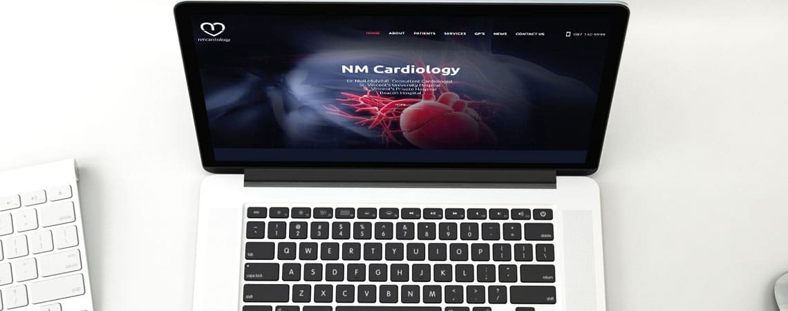 image of NM Cardiology website on laptop computer