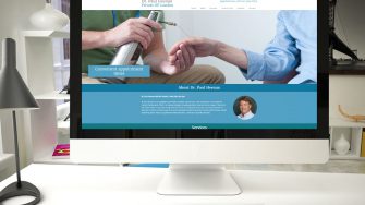 image of website for Dr. Paul Heenan on desktop computer
