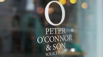 image of Peter O'Connor & Son signage on glass door